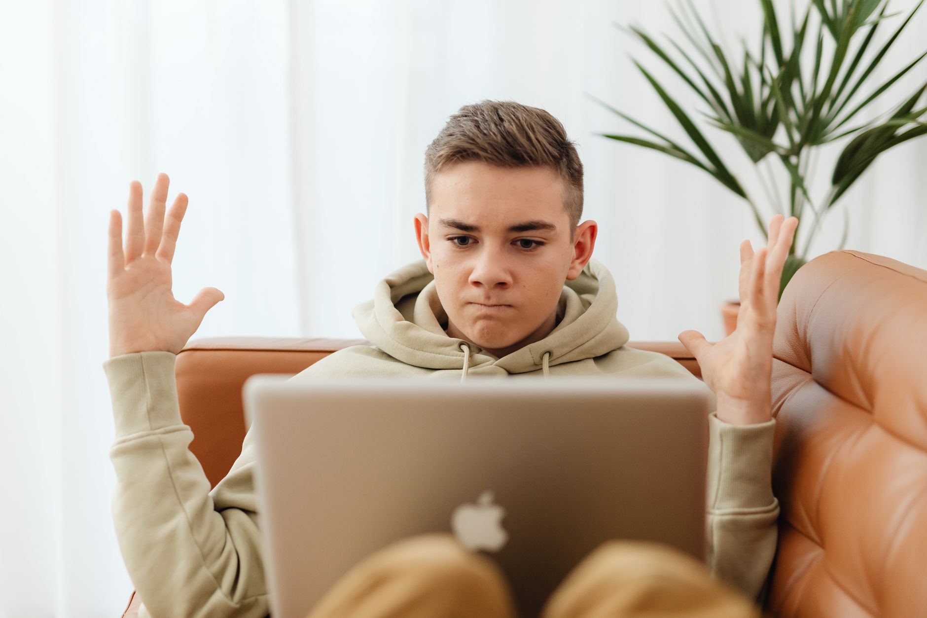 Person frustrated at laptop late at night representing rage applying UK jobs