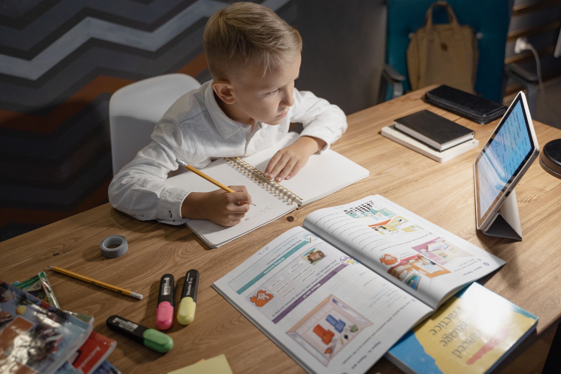 Child doing home education at a desk in a UK home in 2026