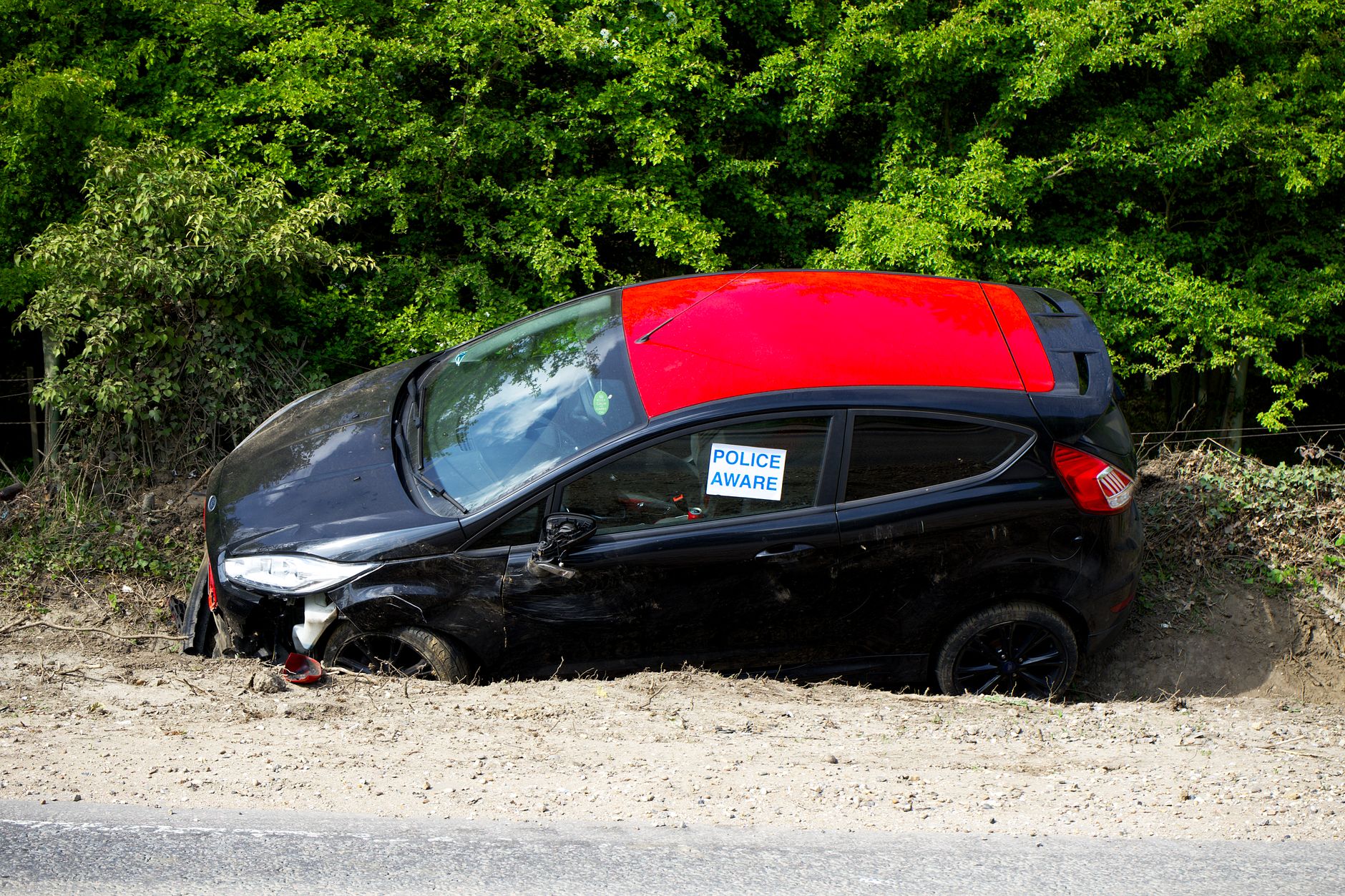 Deep potholes on a deteriorating UK road surface illustrating the pothole damage claims UK crisis