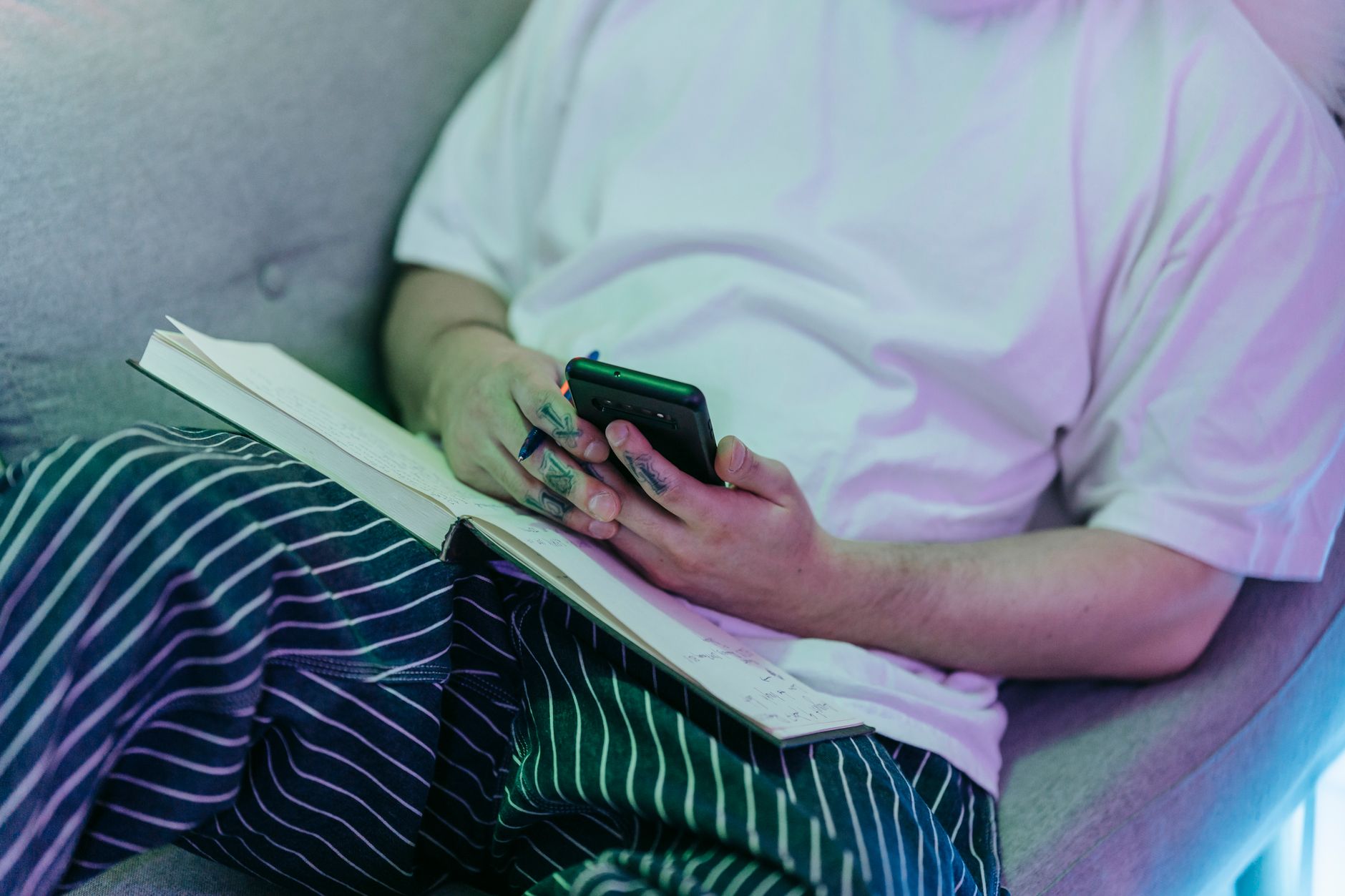 Volunteer coordinator managing a UK volunteer-run organisation rota on a mobile phone